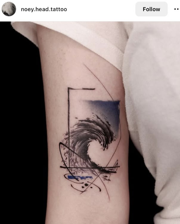 a person with a tattoo on their arm that has a wave coming out of it