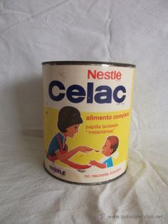 a can of nestle celac sitting on top of a white bed sheet