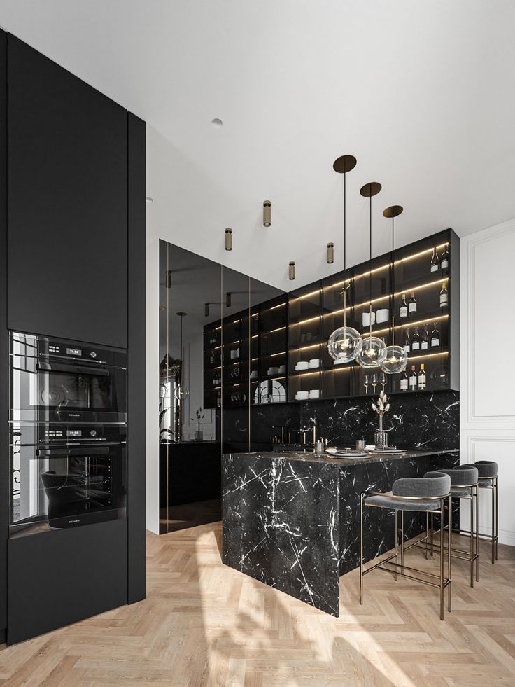 an elegant kitchen with marble counter tops and black cabinets, along with stainless steel appliances