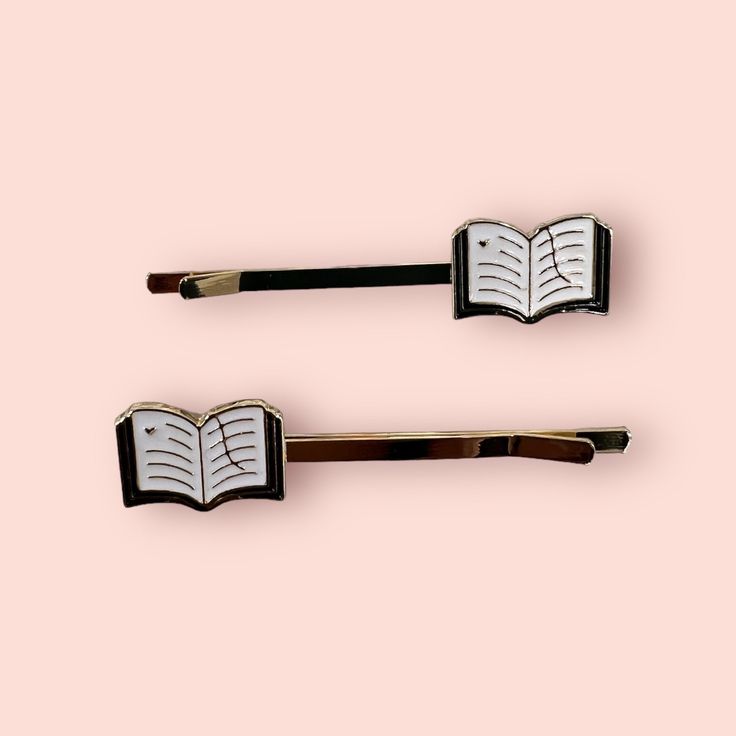 Elevate your hair game with these pretty book pin slides set. Crafted with precision in gold-plated metal and adorned with vibrant enamel books, these hair pins are the perfect accessories for book lovers and avid readers. Showcase your literary passion with style and grace. Each set includes 2 slides  Gold plated Book Pins, Unique Book, Hair Decorations, Book Projects, Hair Game, Style And Grace, Hair Pin, Book Accessories, Gift Item