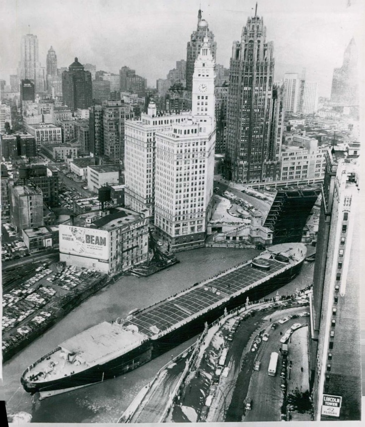 an aerial view of a large city with lots of tall buildings and cars on the street