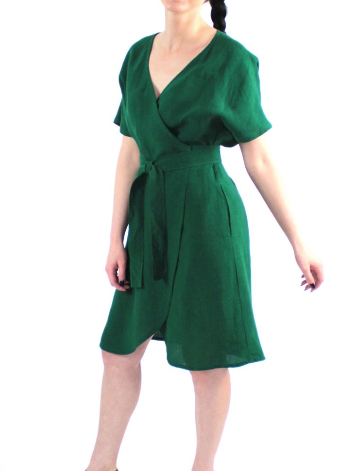 "Handmade loose washed wrap linen dress with kimono sleeves, pockets and belt. Comfortable summer swing dress. Made with love for You. *100% local medium weight linen *Each item is individually cut and sewn by order *The model is wearing size S, dress color - Emerald green *The model height is 168 cm *Note that colors may look different on your display depending on their settings and technical characteristics. Please let us know if you need different measurements or colors. CARE *Machine wash up Beach Wrap Dress With Kimono Sleeves For Summer, Summer Beach Wrap Dress With Kimono Sleeves, Spring Beach Linen Dress With Belt, Summer Short Sleeve Belted Dress, Summer Vacation Belted Wrap Dress, Beach Wrap Linen Dress, Green Short Sleeve Wrap Dress For Beach, Green Belted Wrap Dress For Spring, Spring Linen Belted Dress