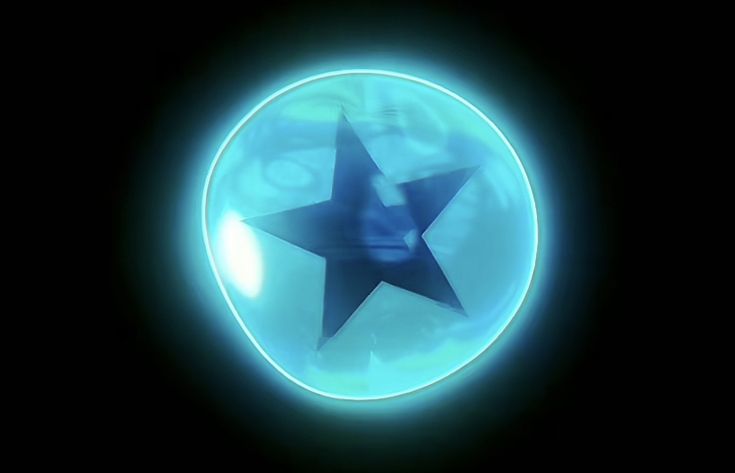 a blue star is in the center of a circular object with light shining through it