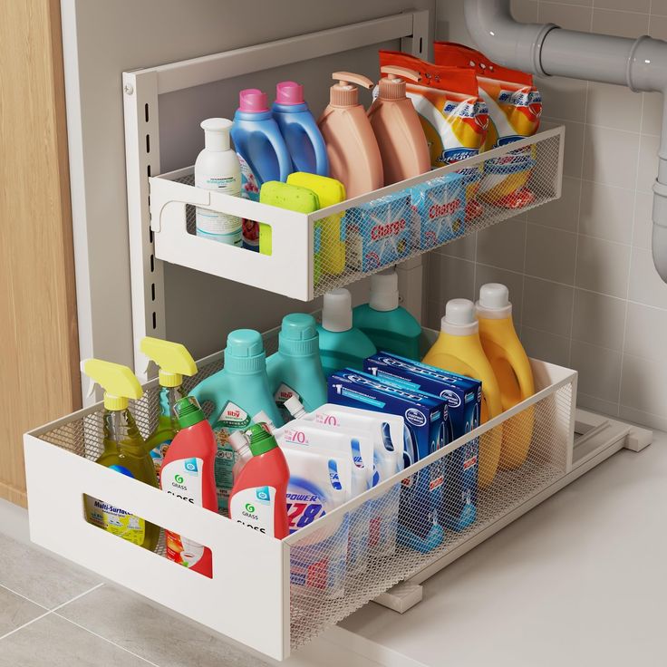 two bins holding cleaning products and toiletries in a bathroom