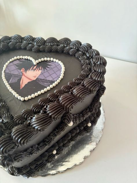 a heart shaped cake with an image of a woman's face on the side