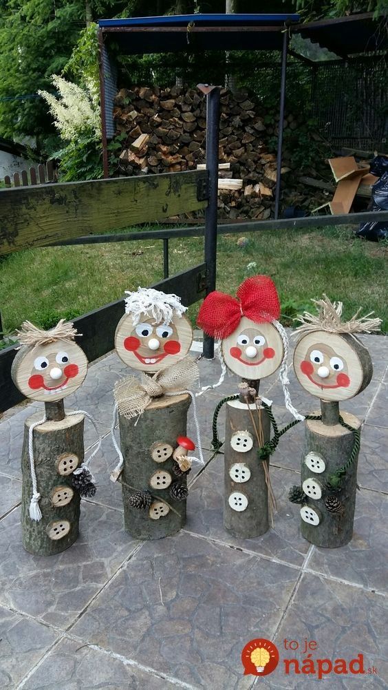 some wooden logs with faces and buttons on them