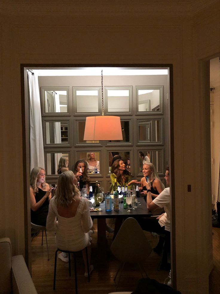 a group of people sitting around a table