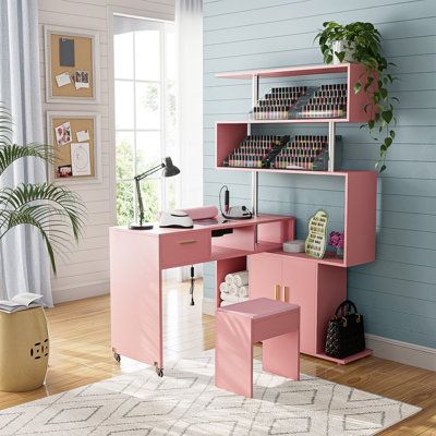 a pink desk and chair in a room