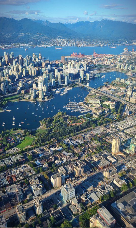 an aerial view of the city and water