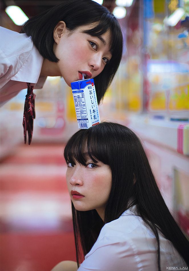 two young women are looking at each other