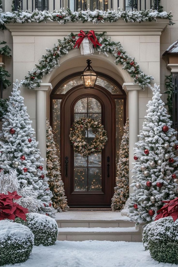 a front door decorated with christmas trees and wreaths