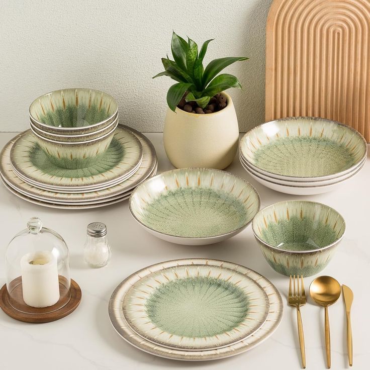 a table topped with lots of plates and bowls