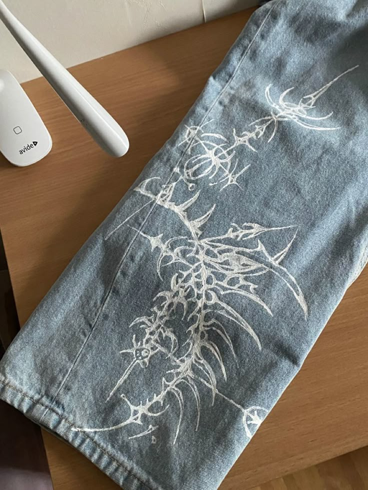 a tea towel on a table next to an electric toothbrush