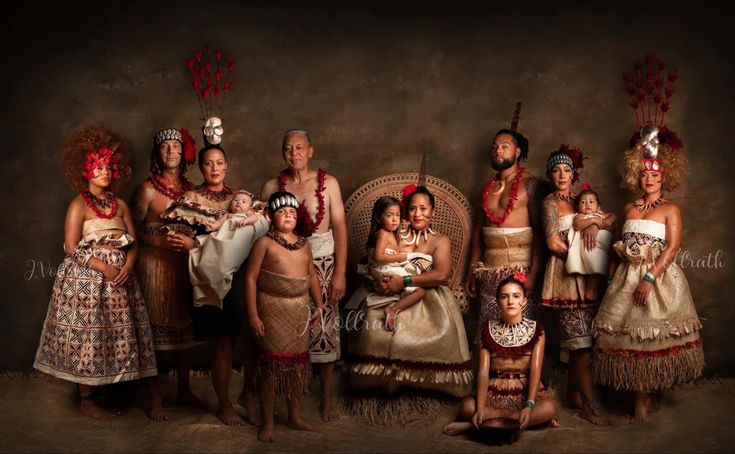 a group of native american people posing for a photo with their baby in the middle