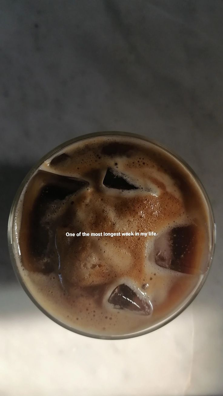 an iced beverage in a glass on a table