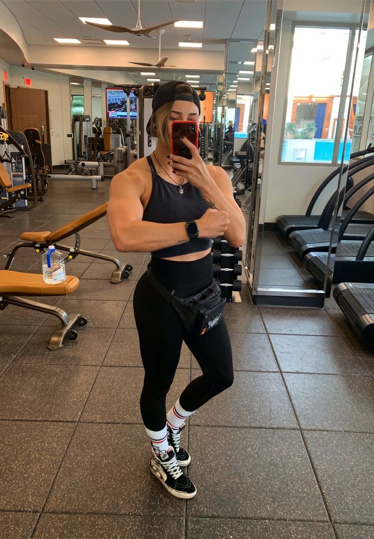 a woman taking a selfie in the gym