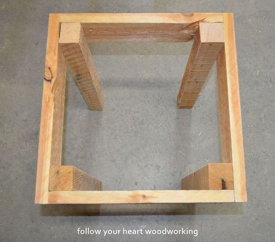 a square wooden frame sitting on the ground