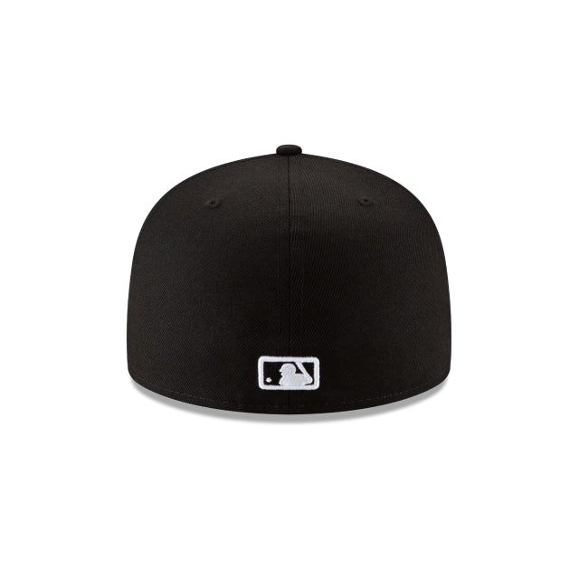 the new era fitted hat in black with white logo on the front and side panel