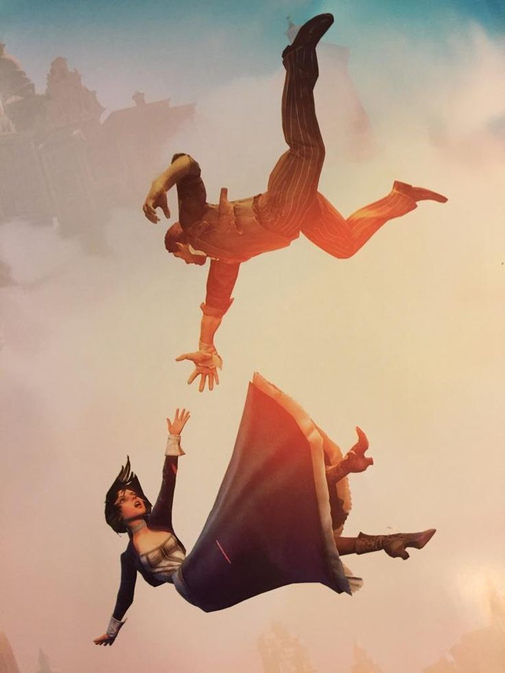 two people are flying through the air with their hands in the air and one is upside down