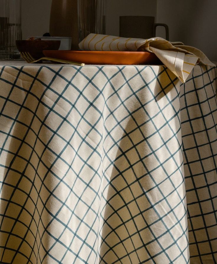 a table with a checkered cloth on it