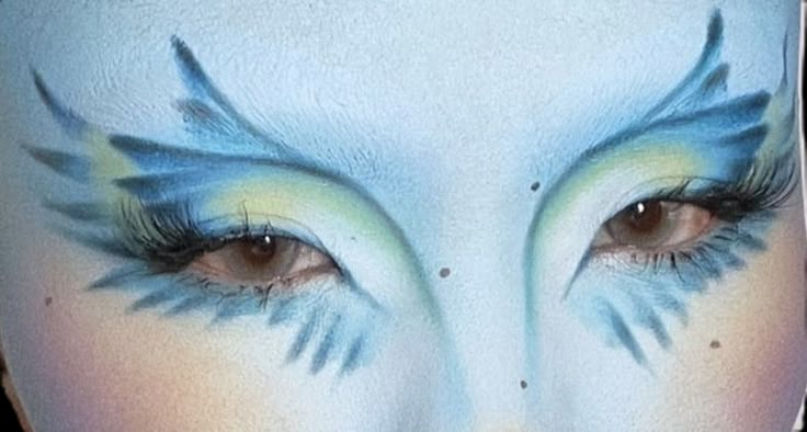 Dinosaur Eyeliner, Bird Makeup Look, Beta Fish Costume, Blue Bird Makeup, Moth Inspired Makeup, Bird Makeup Halloween, Bird Inspired Makeup, Bird Makeup Ideas, Dr Seuss Makeup