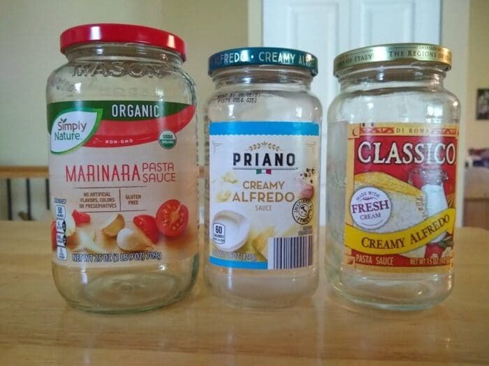 three jars with different types of food in them