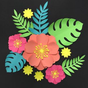 paper flowers and leaves on a black background