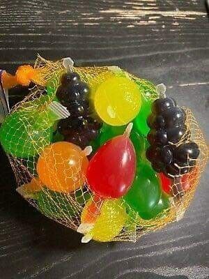 a bag full of fruit sitting on top of a table