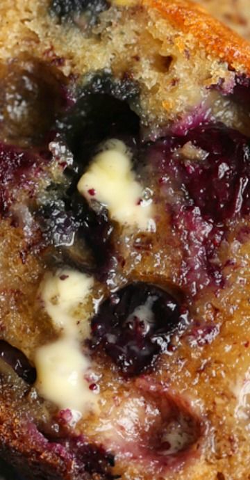 blueberry bread with butter and syrup on top