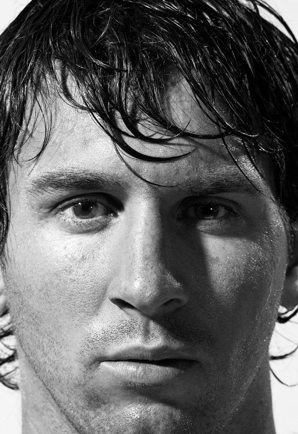 black and white photograph of a man with wet hair looking at the camera, close up