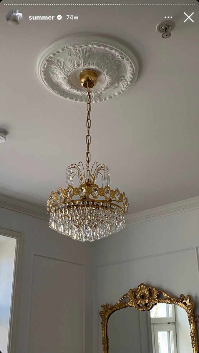 a chandelier hanging from the ceiling in a room