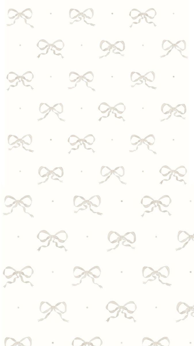 a white wallpaper with grey bows on it