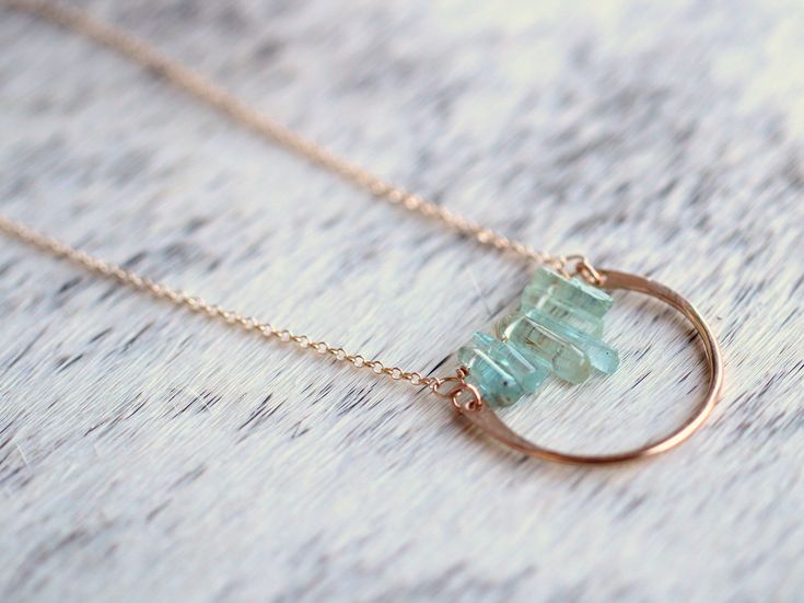 This necklace combines the beauty of abstract design with the ease and simplicity of a minimalist piece. A gorgeous row of gorgeous raw Aquamarine sticks in various lengths are set into 14k Gold Filled chain and accented with a 14k Gold Filled semi-circle creating a modern pendant that’s easy to reach for daily. The texture and soft hue of these beautiful, natural Aquamarine gemstones give this bohemian necklace an ethereal feel.Shown in 14k Gold Fill but also available in 14k Rose Gold Fill or Handmade Minimalist Mineral Crystal Necklace, Turquoise Aquamarine Necklace With Natural Stones, Turquoise Aquamarine Healing Necklace, Handmade Spiritual Aquamarine Necklace, Raw Aquamarine Necklace, Bar Graph, Raw Stone Jewelry, Raw Aquamarine, Aquamarine Necklace