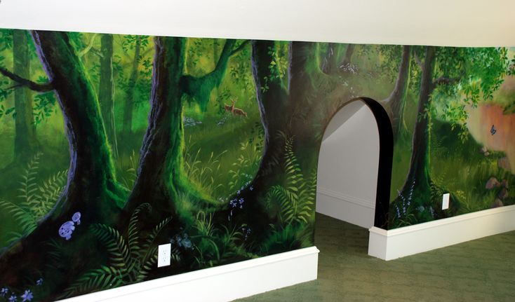 a large mural on the wall of a room with trees and plants painted on it