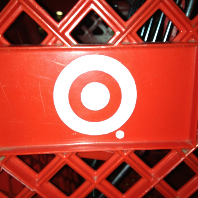 a red sign with white circles on it