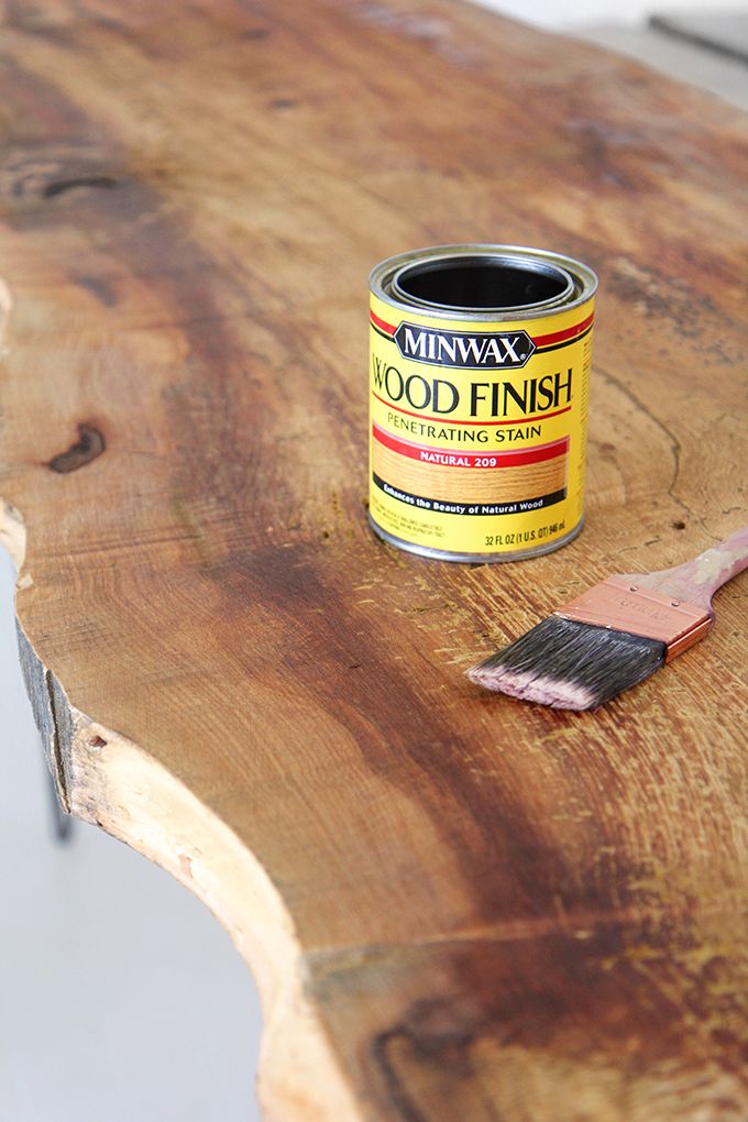 a paint can sitting on top of a wooden table