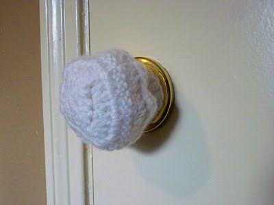 a close up of a door knob with a white ball on it's side