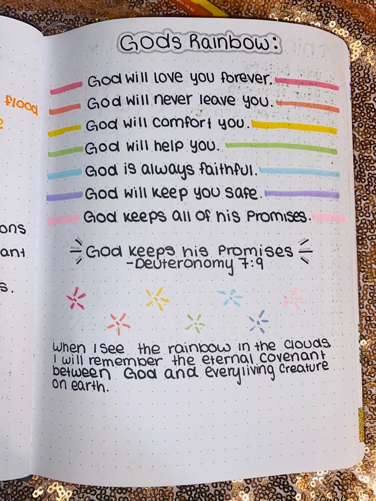 an open bible with the words god's rainbow written in cursive writing