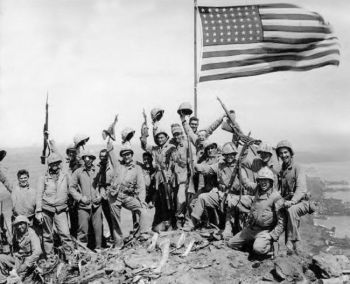 an old black and white photo of people carrying flags