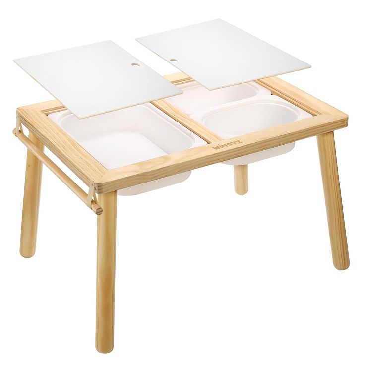 a wooden table with two trays on it