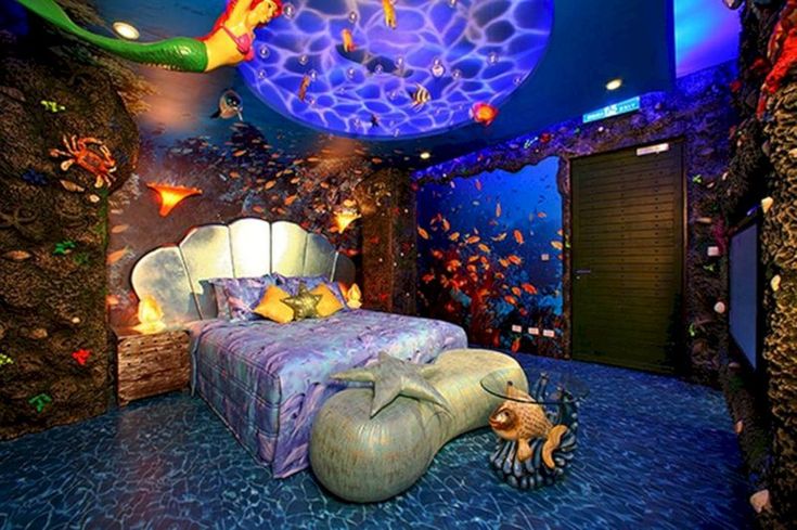 a bedroom with an aquarium themed bed in the middle