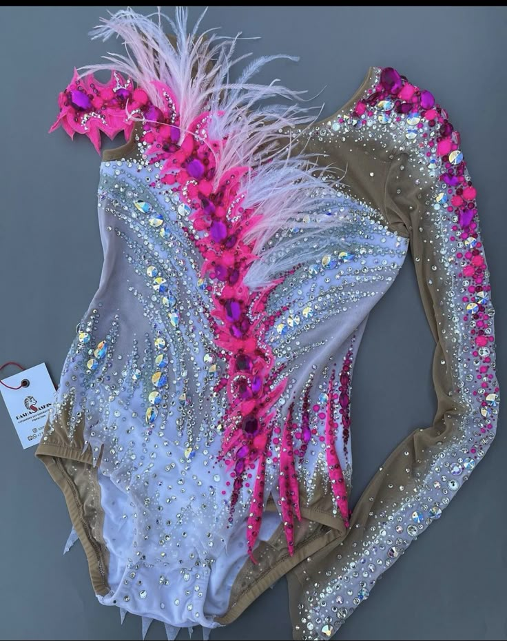 a bathing suit with pink and white feathers on it