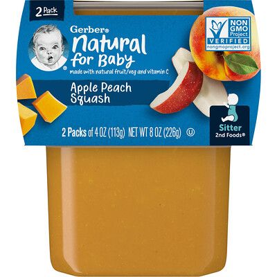 an apple and peach smoothie in a plastic container with the label for natural baby