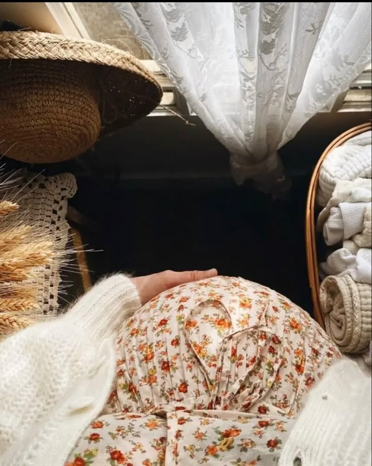 a woman is laying down with her head on the ground in front of a mirror