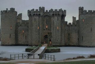 an old castle with snow on the ground