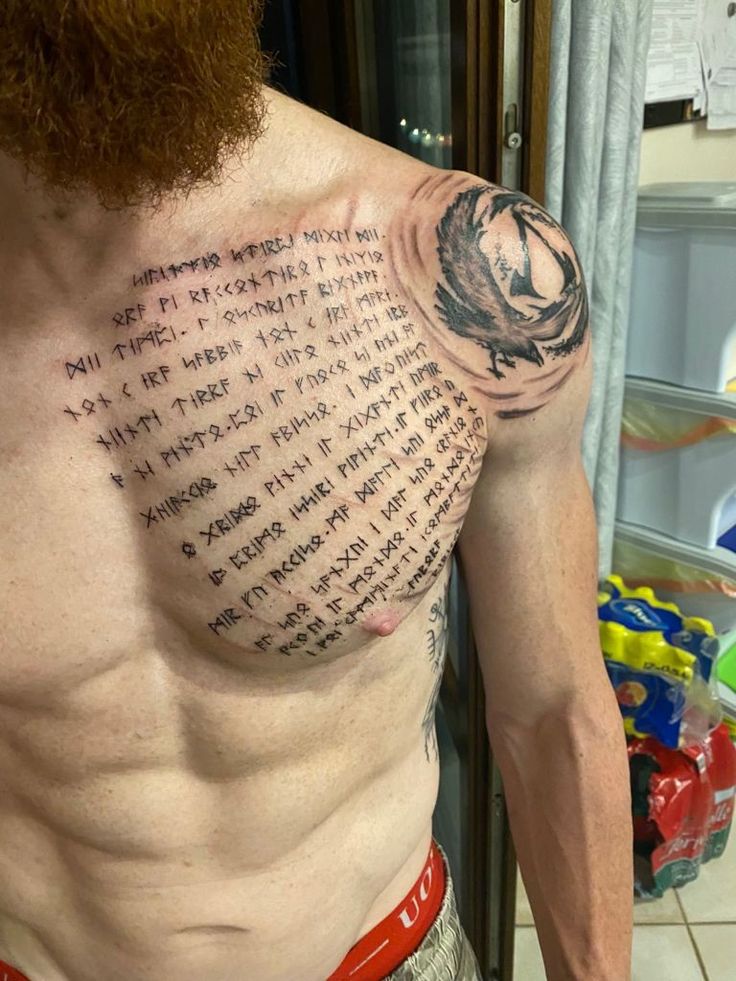 a man's chest with some writing on it