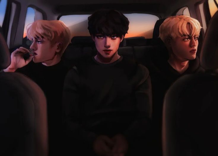 three boys sitting in the back seat of a car