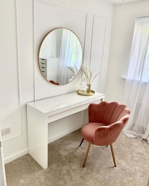 a white desk with a mirror and chair