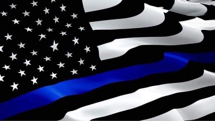 an american flag with the thin blue line on it's side and stars in the background