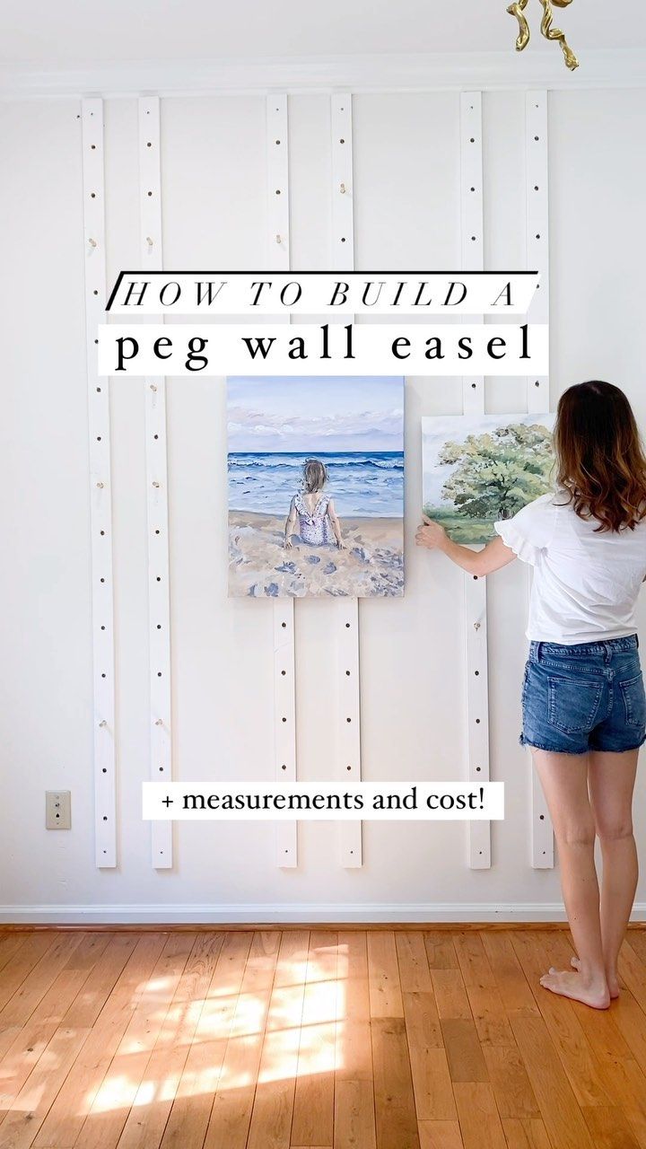 a woman standing in front of a painting on a wall with the words how to build a pegwall easel